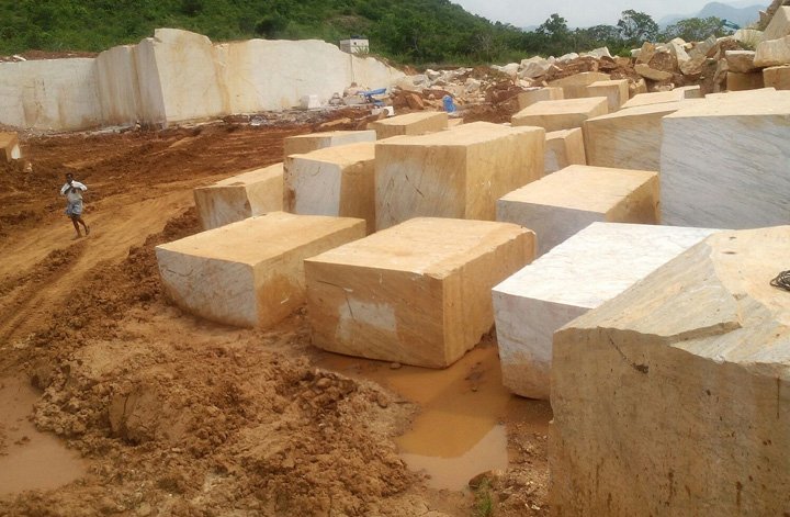 Colonial white , gold , cream granite quarry blocks